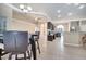 Bright kitchen with tile flooring, recessed lights, dark cabinets, and bar seating at 3211 Countryside View Dr, St Cloud, FL 34772