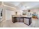 Kitchen with stainless steel dishwasher, sink, granite countertop, tile floor, and plenty of storage at 3211 Countryside View Dr, St Cloud, FL 34772