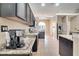 Kitchen with stainless steel appliances, granite countertops, tile flooring, and dark cabinets at 3211 Countryside View Dr, St Cloud, FL 34772