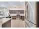 The spacious kitchen features stainless steel appliances, granite countertops and tile flooring at 3211 Countryside View Dr, St Cloud, FL 34772