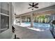 Expansive lanai with ceiling fans overlooking a screened pool, perfect for outdoor living and entertaining at 3211 Countryside View Dr, St Cloud, FL 34772