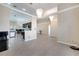 Open-concept living space with chandelier lighting, tiled floors, and views of the kitchen and foyer at 3211 Countryside View Dr, St Cloud, FL 34772