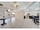 Spacious living room with tile floors, high ceilings, and an open layout to the kitchen at 3211 Countryside View Dr, St Cloud, FL 34772