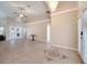 Spacious living room with high ceilings, neutral walls, tile flooring, and ample natural light at 3211 Countryside View Dr, St Cloud, FL 34772