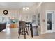 Living space featuring tile floors, aquarium, and table with chairs under a chandelier at 3211 Countryside View Dr, St Cloud, FL 34772