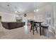 Open living space with tile floors, leather sofa, aquarium, and table with chairs at 3211 Countryside View Dr, St Cloud, FL 34772