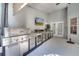 Outdoor kitchen featuring grill, TV, countertop, cabinets, and sink at 3211 Countryside View Dr, St Cloud, FL 34772