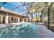 Screened-in pool with clear blue water, a patio, and palm trees, creating an inviting outdoor space at 3211 Countryside View Dr, St Cloud, FL 34772