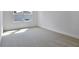 Bright bedroom featuring neutral walls, large windows, and ample space at 3629 Sublett Loop, Tavares, FL 32778