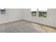 Neutral bedroom with plush carpeting and plenty of natural light from two windows at 3629 Sublett Loop, Tavares, FL 32778