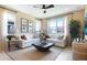 Cozy living room with ample seating, natural light, and modern decor at 3723 Malad Way, Tavares, FL 32778