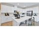 Bright kitchen with stainless steel appliances, a large island with barstool seating, and modern finishes at 4071 Bannock Ave, Tavares, FL 32778