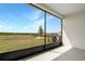 Screened patio offers serene views of the expansive green landscape and the community beyond, promoting relaxation at 4071 Bannock Ave, Tavares, FL 32778