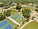 Aerial view highlights the community's basketball and tennis courts, perfect for active residents at 42 Chip Ct, Kissimmee, FL 34759