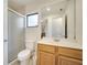 Bathroom features a glass-enclosed shower, a wood vanity, tile flooring, and neutral paint at 42 Chip Ct, Kissimmee, FL 34759