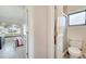 The bathroom is adjacent to the bedroom and features a glass-enclosed shower and a wood vanity at 42 Chip Ct, Kissimmee, FL 34759