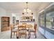 Cozy dining area with pendant lighting and bar access to kitchen at 42 Chip Ct, Kissimmee, FL 34759