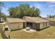 Aerial view of the back of the home with a screened in patio and fenced in backyard at 42 Chip Ct, Kissimmee, FL 34759