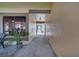 A covered hallway with a view of the outside, potted plants, and neutral paint at 42 Chip Ct, Kissimmee, FL 34759