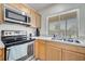 Updated kitchen featuring stainless steel appliances and ample counter space at 42 Chip Ct, Kissimmee, FL 34759