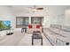 Cozy living room with large windows and comfortable seating arrangement at 42 Chip Ct, Kissimmee, FL 34759