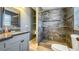 Modern bathroom showcasing gray tiled walk-in shower and stylish vanity at 4218 Drexel Ave, Orlando, FL 32808