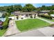 Well-maintained single-story home boasting a lush, green lawn and charming stone accents at 4218 Drexel Ave, Orlando, FL 32808
