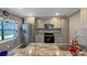 Updated kitchen featuring stainless steel appliances, granite countertops, and gray cabinetry at 4218 Drexel Ave, Orlando, FL 32808
