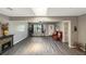 Bright living room featuring wood floors, a decorative fireplace, and skylight at 4218 Drexel Ave, Orlando, FL 32808