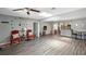 Inviting living room with wood floors, skylight, and easy access to the kitchen at 4218 Drexel Ave, Orlando, FL 32808