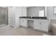 Bright bathroom featuring a double sink vanity, walk-in shower, and separate soaking tub at 4290 Paragraph Dr, Kissimmee, FL 34746