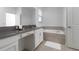 Bright bathroom featuring a double sink vanity with a makeup station and separate soaking tub at 4290 Paragraph Dr, Kissimmee, FL 34746