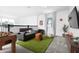 Cozy bonus room featuring a foosball table, sofa, and sports-themed decor, ideal for relaxing at 4290 Paragraph Dr, Kissimmee, FL 34746