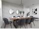 Modern dining room with a long table and stylish chairs, perfect for entertaining guests at 4290 Paragraph Dr, Kissimmee, FL 34746