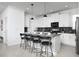Modern kitchen boasting white cabinets, sleek countertops, a large island, and stainless steel appliances at 4290 Paragraph Dr, Kissimmee, FL 34746