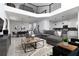 Spacious living room featuring modern decor, large sectional sofa, and high ceilings at 4290 Paragraph Dr, Kissimmee, FL 34746