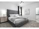 Comfortable bedroom featuring neutral tones, a large bed, and modern furnishings at 4290 Paragraph Dr, Kissimmee, FL 34746