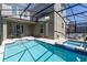 Screened-in pool and spa with a patio dining area, ideal for outdoor entertaining at 4290 Paragraph Dr, Kissimmee, FL 34746
