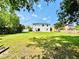 Expansive backyard with lush green lawn and ample space for outdoor activities and relaxation at 467 Martigues Drive, Kissimmee, FL 34759