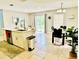 Bright kitchen island featuring stainless steel appliances, white cabinets, and a stylish countertop at 467 Martigues Drive, Kissimmee, FL 34759