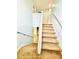 Carpeted staircase with white railings leading to the upper level of the home at 467 Martigues Drive, Kissimmee, FL 34759