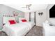 Charming bedroom with two beds, Mickey Mouse decor, and bright, natural light at 4832 Dedication St, Kissimmee, FL 34746
