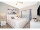 Comfortable bedroom with ceiling fan, neutral decor, and plenty of natural light at 4832 Dedication St, Kissimmee, FL 34746
