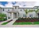 Charming two-story townhouse with a well-maintained lawn and landscaping at 4832 Dedication St, Kissimmee, FL 34746