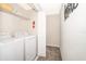 Functional laundry area with modern appliances and ample storage space at 4832 Dedication St, Kissimmee, FL 34746