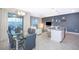 Open-concept living area featuring modern decor and access to the outdoor pool area at 4832 Dedication St, Kissimmee, FL 34746