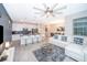 Bright open-concept kitchen and living area with stainless appliances and cozy seating at 4832 Dedication St, Kissimmee, FL 34746