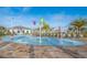 Community splash pad with colorful water features and lounge chairs at 4832 Dedication St, Kissimmee, FL 34746