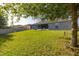 Spacious, well-kept backyard with a view of the house and fencing at 501 Pheasant Dr, Haines City, FL 33844