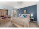 A serene bedroom with light blue walls, a cozy bed, and ample storage space at 501 Pheasant Dr, Haines City, FL 33844